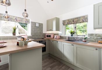 The kitchen has a lovely colour scheme and is modern and stylish.