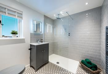Step into the rainfall shower and wash off the sand from a day on the beach.