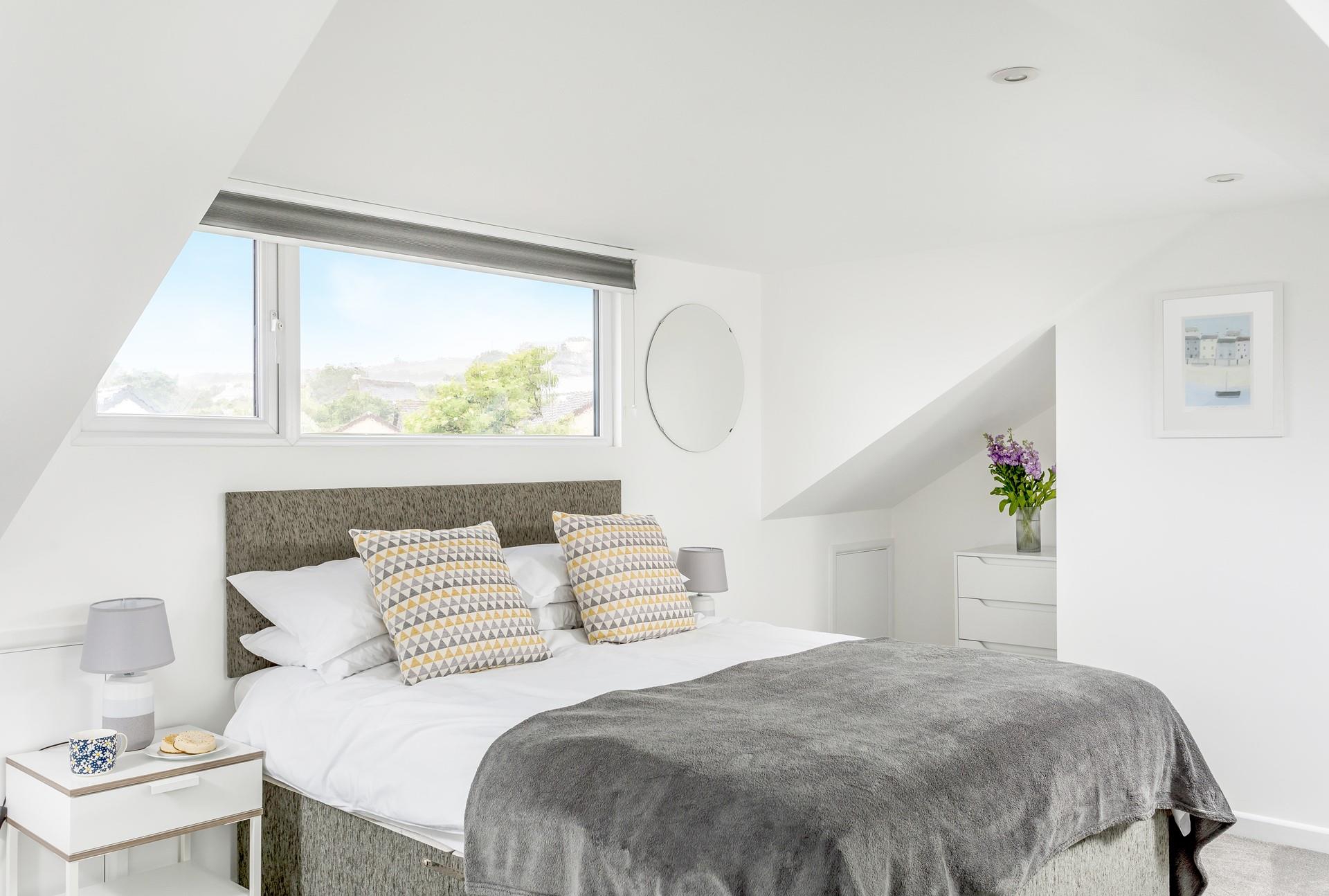 Bedroom 2 has a spacious king size bed to tuck into each night.