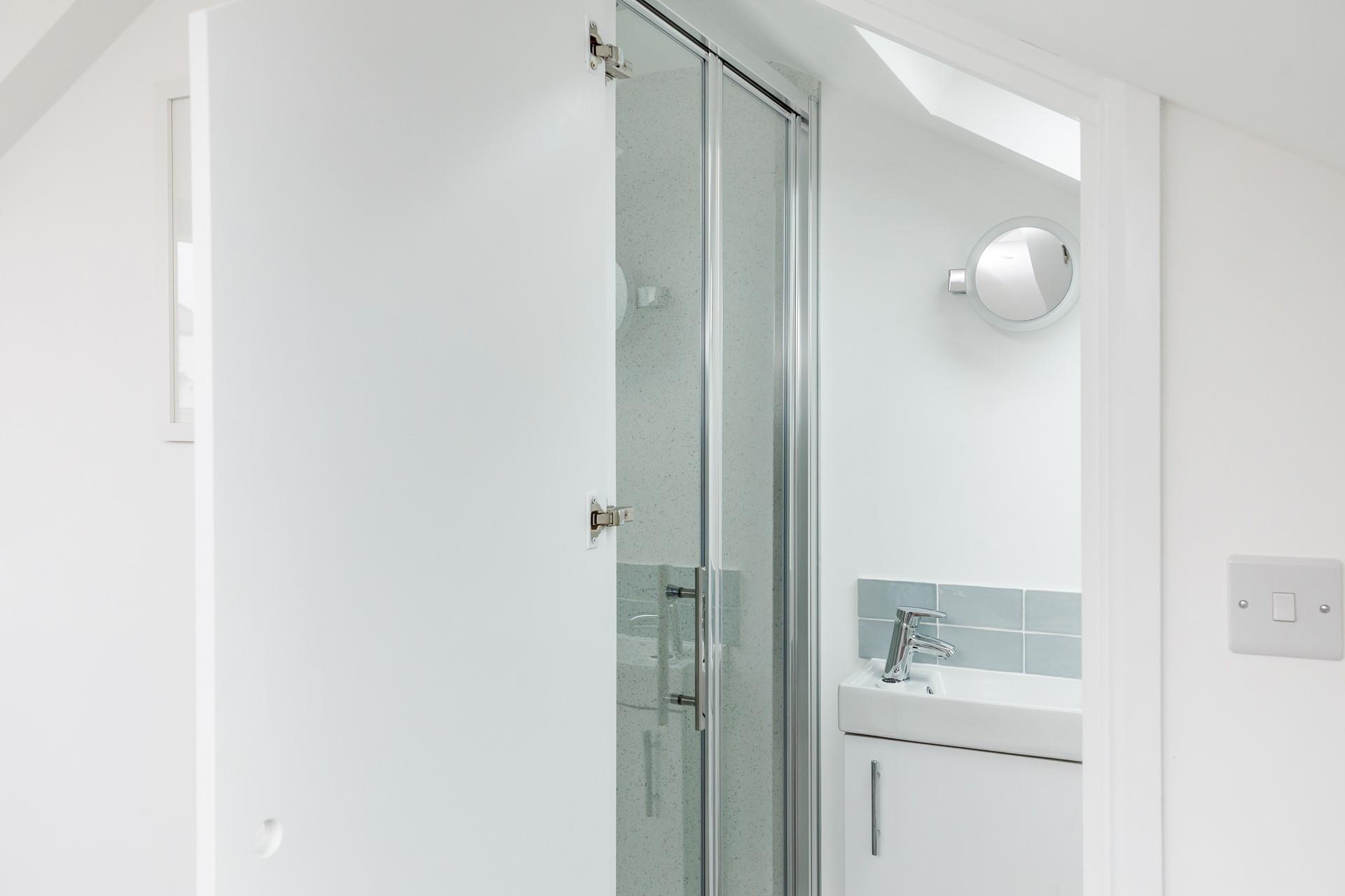 Wash off the sand in the shower after a day spent on the beach.