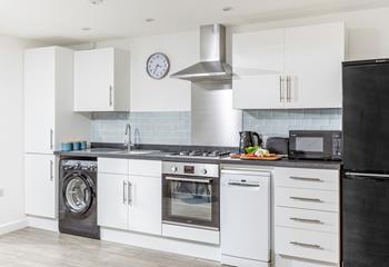 The kitchen is modern and well-equipped for cooking up a storm.