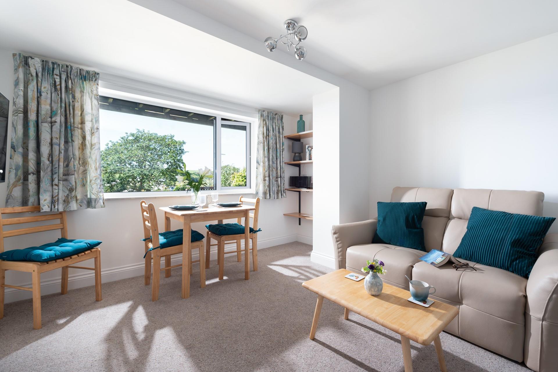 Sink into the sofa and enjoy a movie with the feature electric fire on in the background.