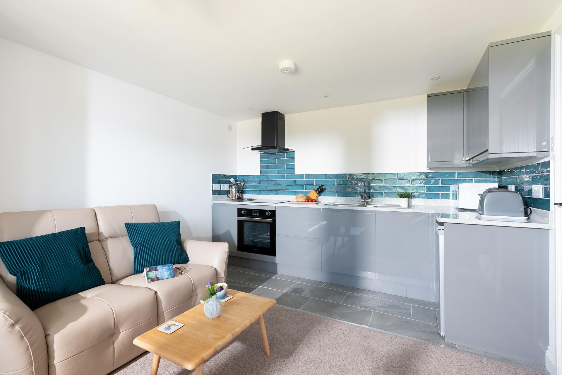 The modern kitchen is sleek and well-equipped for all your culinary needs.