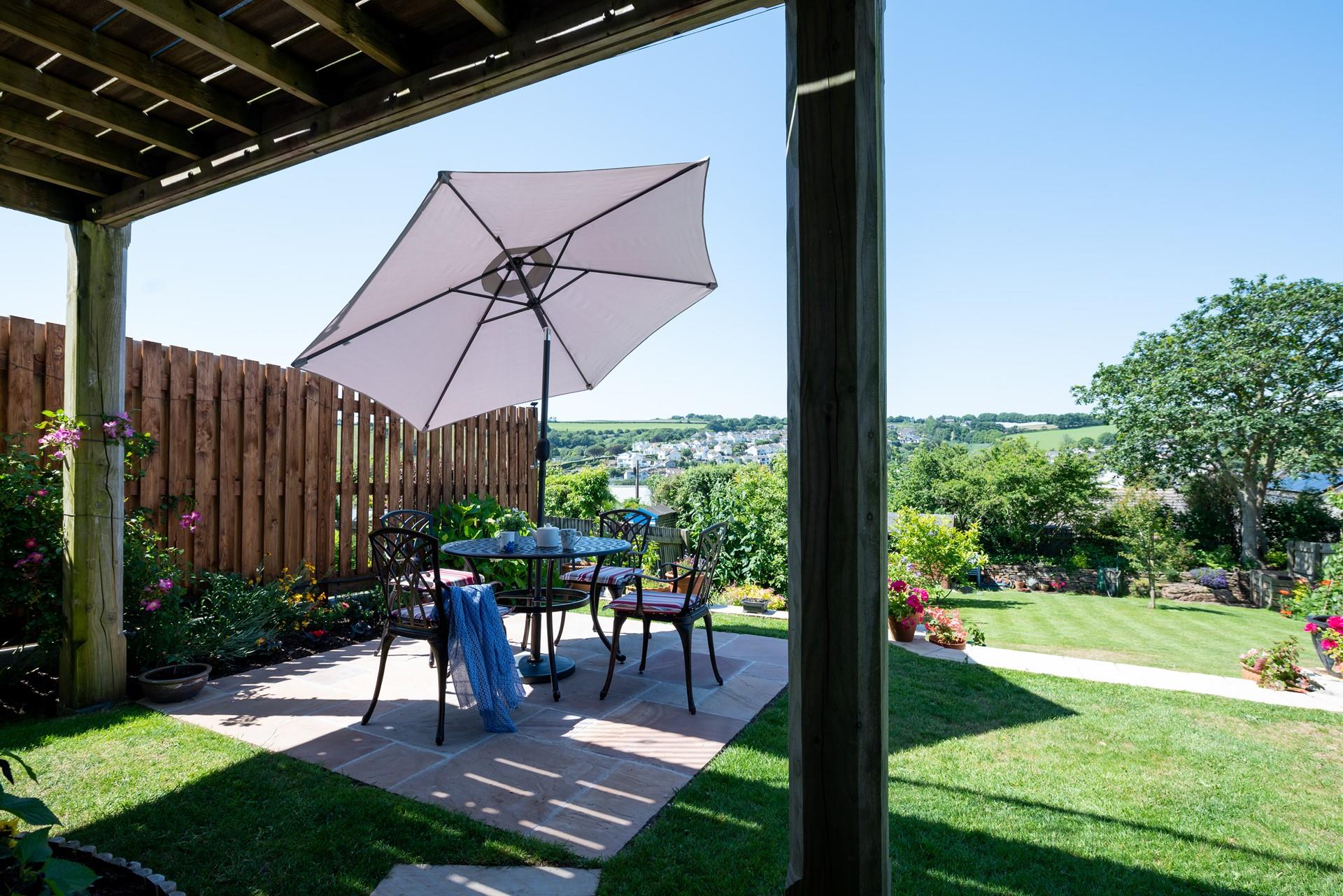 Sit in the leafy garden and take in the lovely views of Mevagissey.