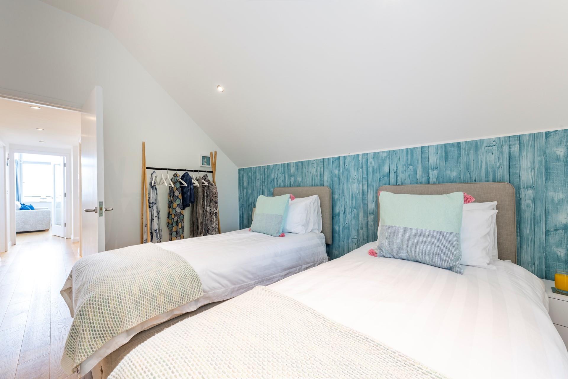 Bedroom 2 can be made up of twin beds or king size for flexible sleeping arrangements.