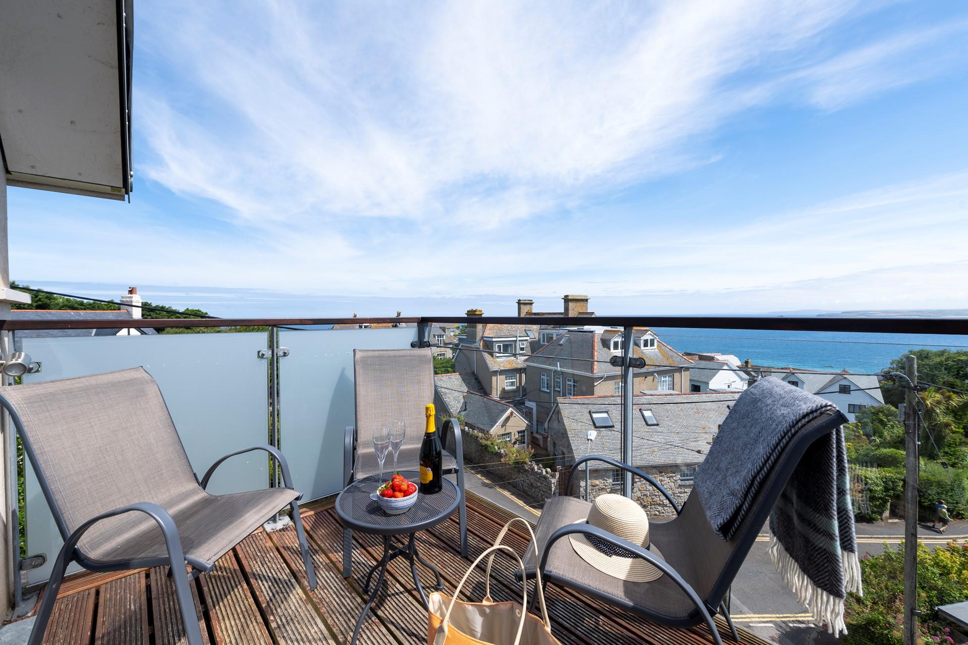Kick back and relax as the sun comes down with wine and nibbles on the balcony.