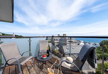 Kick back and relax as the sun comes down with wine and nibbles on the balcony.