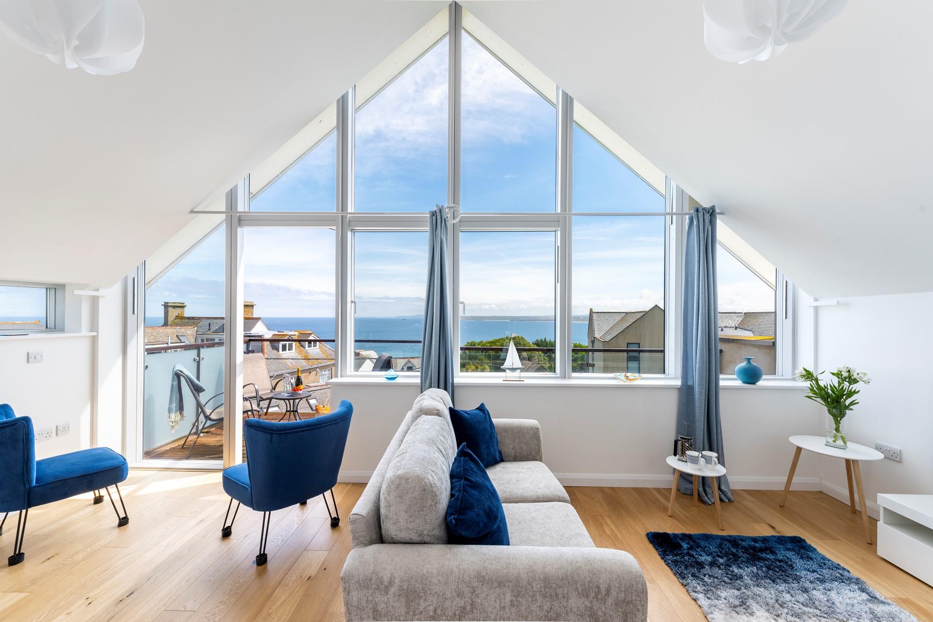 Sink into the soft sofa and gaze out at the breathtaking vistas.