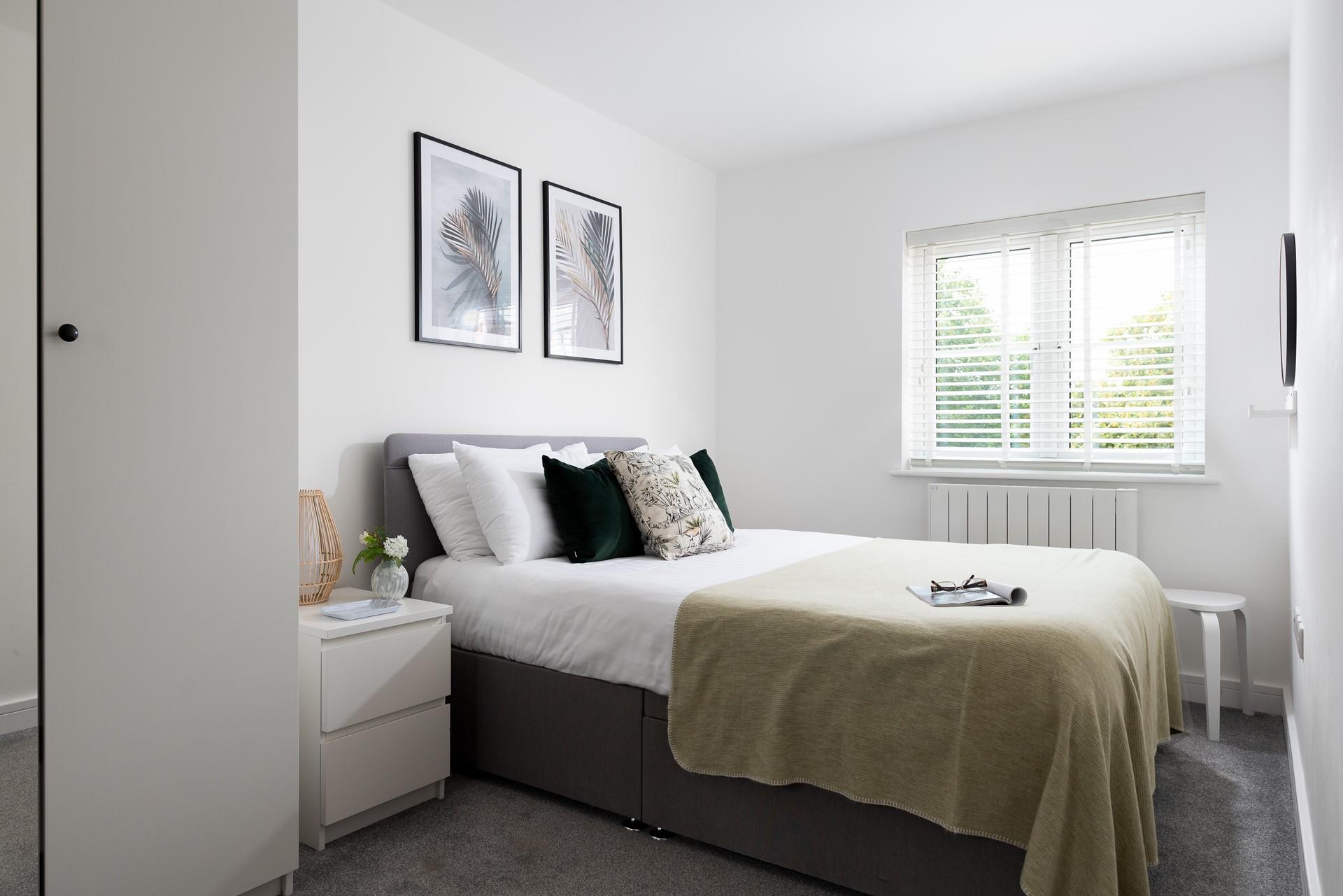 The bedroom is a welcoming space to relax after enjoying some sea air.