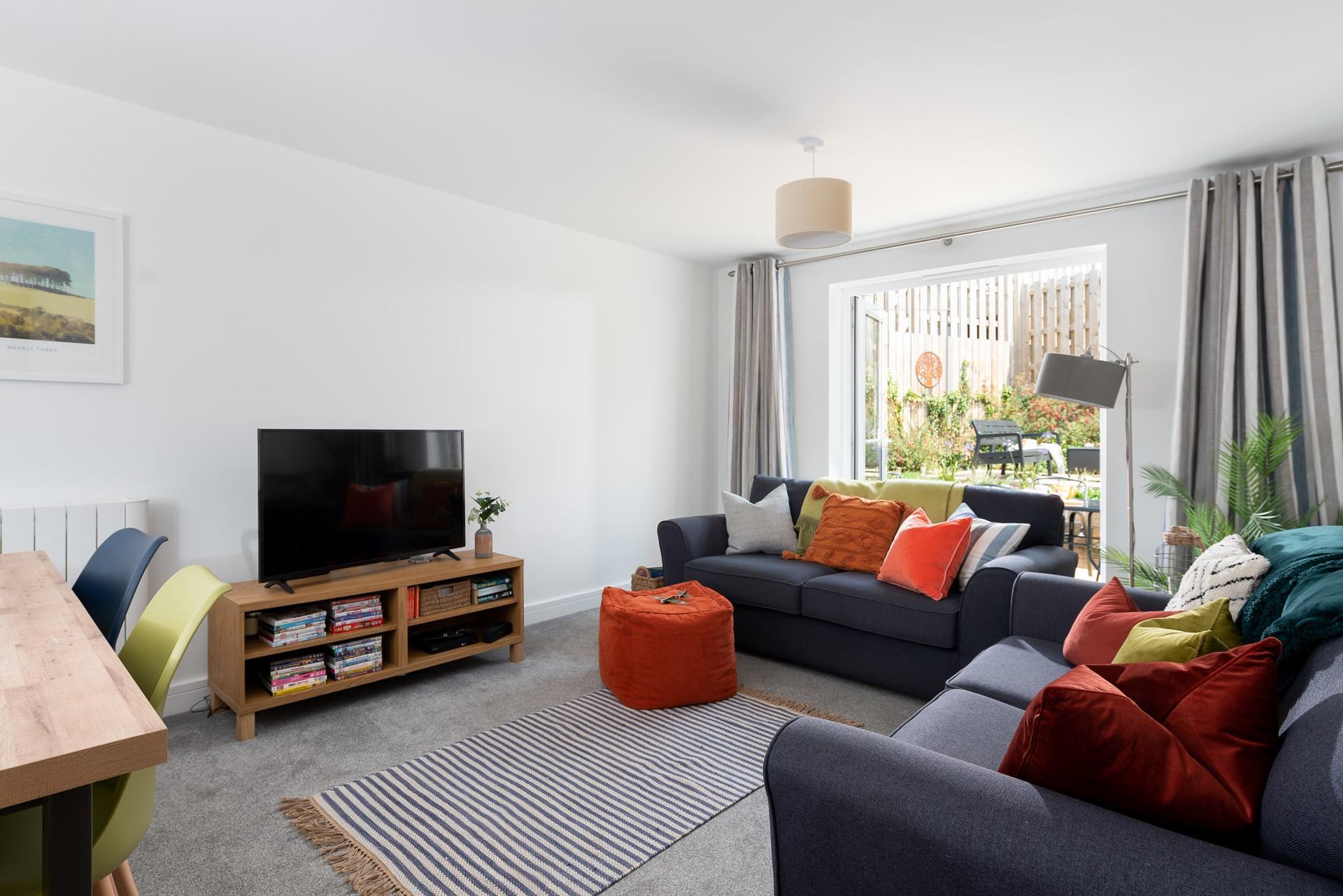 Airy and filled with light, pop your feet up in the lounge and enjoy a spot of quiet reading or gather your loved ones together for a movie night.