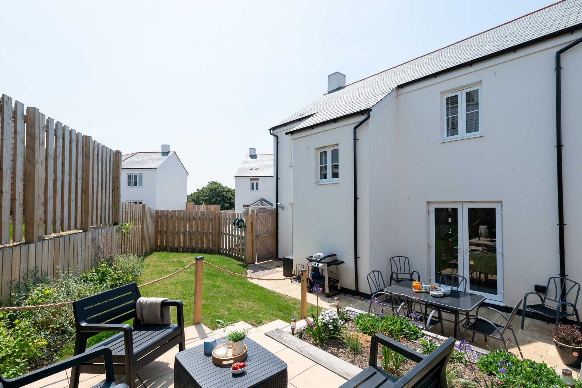 Pretty garden with ample seating to sit back and relax with a good book.