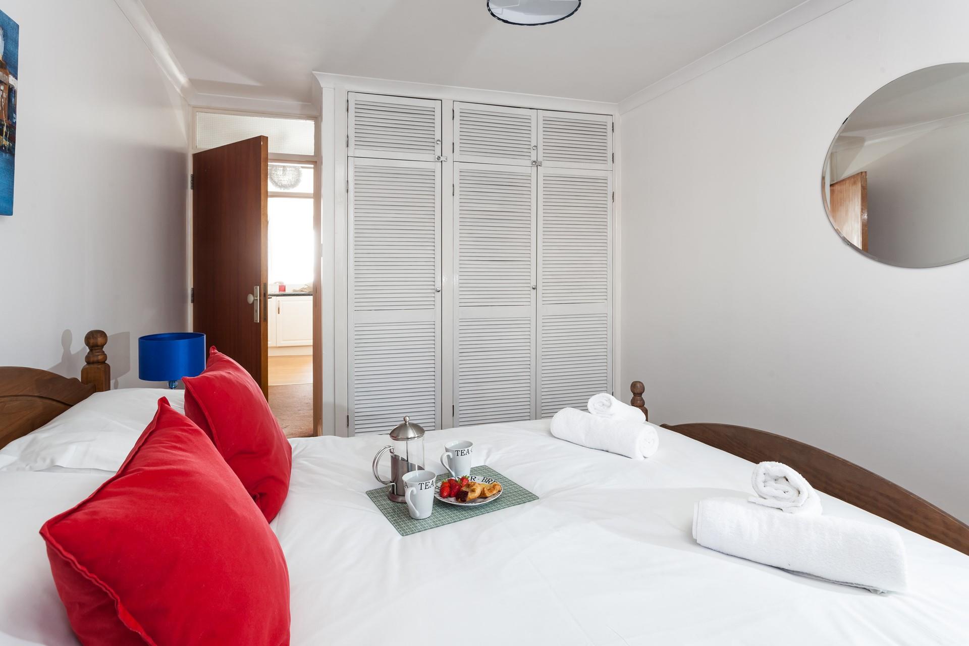 Bedroom 1 has a spacious king size bed to drift off for a peaceful night's sleep.