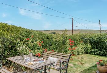 A picnic bench to enjoy meals outside on a hot sunny day.