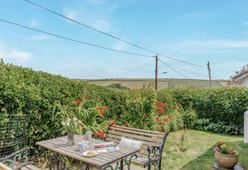 Sit back and enjoy the Cornish sunshine in the beautiful, blooming garden.