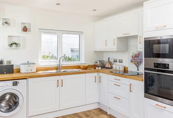 A spacious kitchen that is well-equipped with everything you could need.