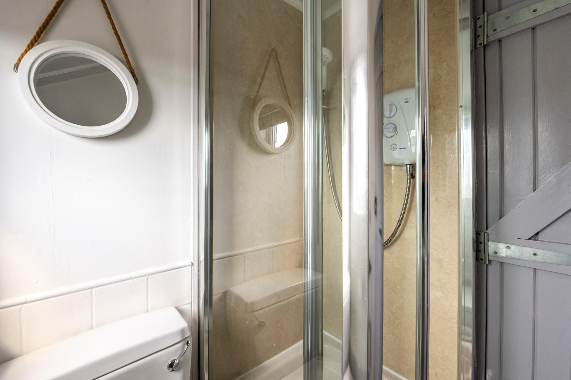 Wash off the sand in the shower after a day on the beach.