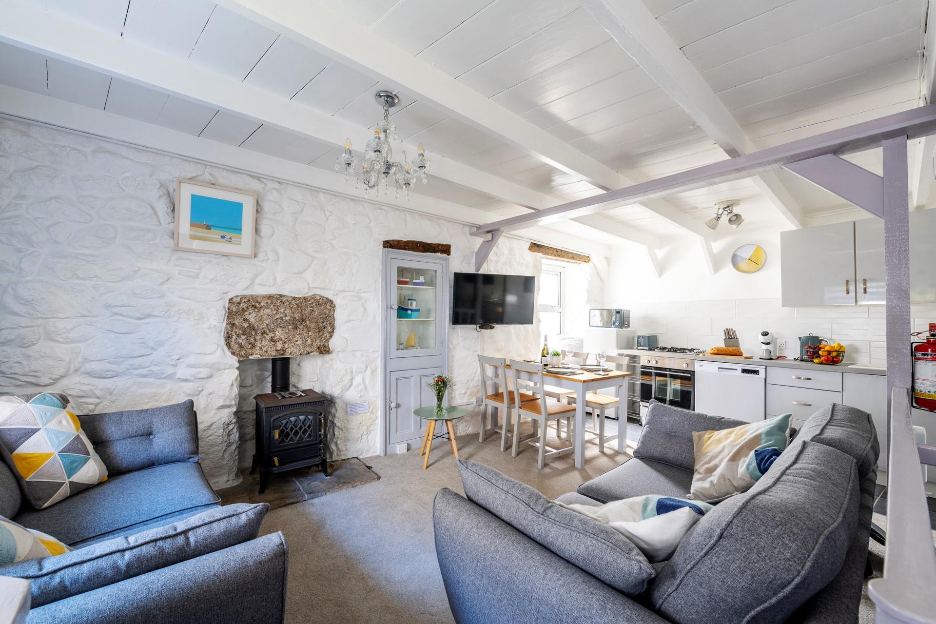 Snuggle up on plush grey sofas and enjoy a cosy night in.