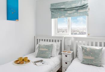 A cool, comfortable twin bedroom with a harbourside feel.