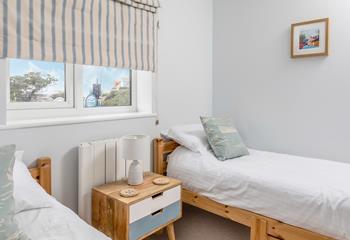 The second twin bedroom, with more seaside decor and rustic features.