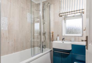 The main bathroom on the first floor, with bath and shower.