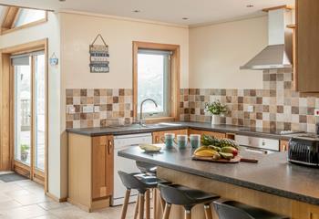 Natural tones in the spacious kitchen, with a nod to the beachside location!