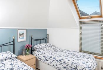 The bright and airy twin bedroom is ideal for kids and adults alike.