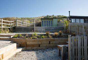 The rear garden has a summer house for al fresco drinks.