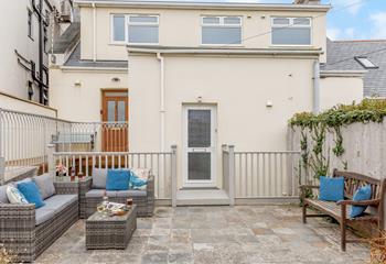 The rear courtyard is a lovely suntrap, and just moments away from the coast path.