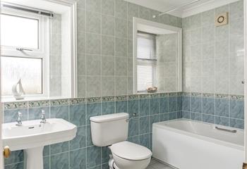 A spacious family bathroom means you can wash off those sandy toes with ease.