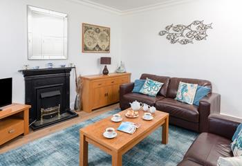 Relax with family and friends in the comfortable living room.
