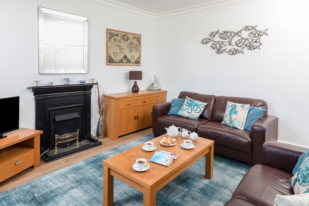 Relax with family and friends in the comfortable living room.