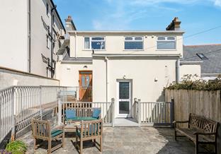 The rear courtyard is a lovely suntrap, and just moments away from the coast path.