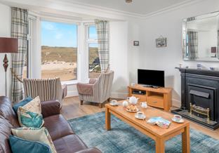 Open the windows and let the sound of the sea in!