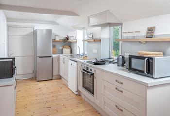 The kitchen is modern and well equipped for cooking delicious meals.