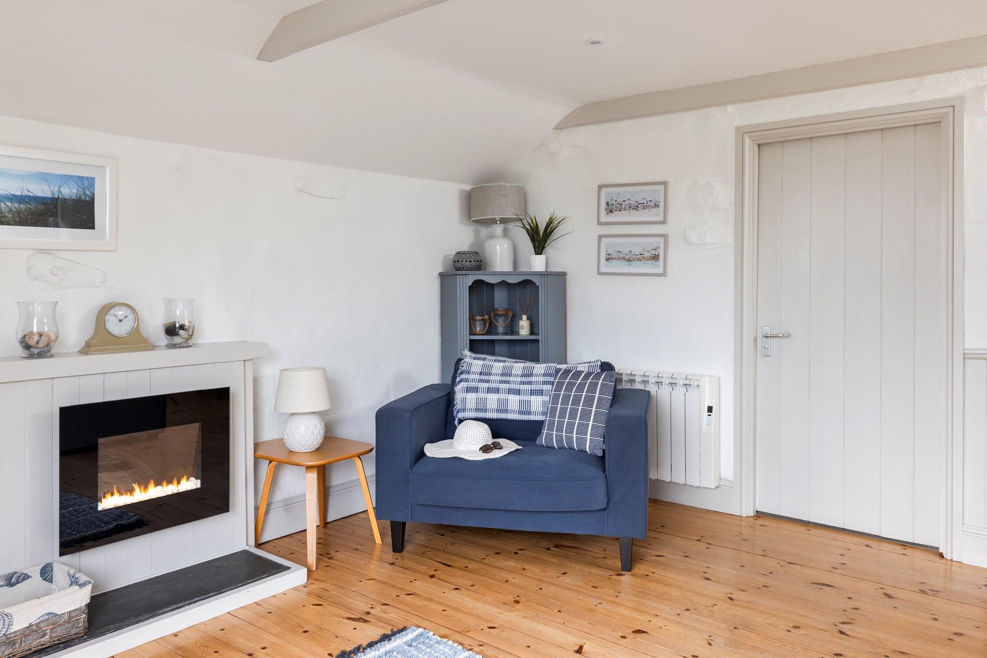 The spacious sitting room is ideal for relaxing nights in.