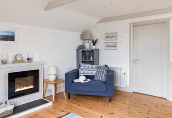 The spacious sitting room is ideal for relaxing nights in.