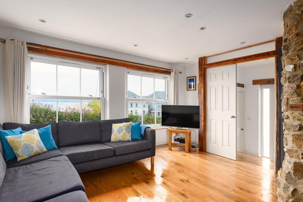 Cosy up in the sitting room with the beautiful sea view backdrop.