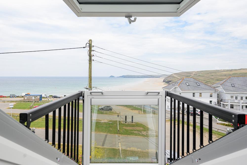 Far-reaching views across Perranporth Beach can be enjoyed from the bedrooms.