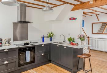 The large kitchen/dining room is perfect for preparing and cooking tasty meals.