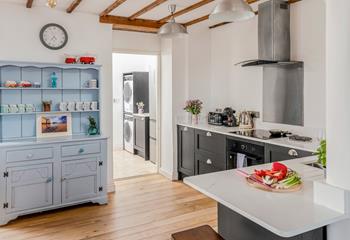 The modern kitchen has all the appliances needed to cook tasty meals.