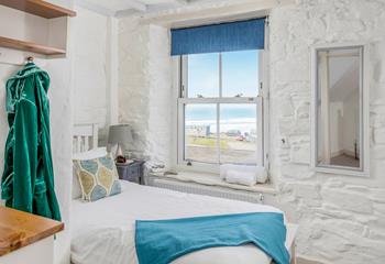 Bedroom 2 has a single bed and also has beautiful sea views.