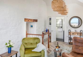 The sunroom is the perfect spot for watching the waves roll onto the beach.