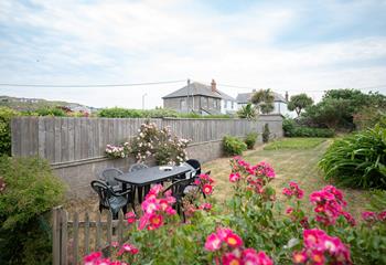 The large garden is perfect for watching the kids and dogs play.