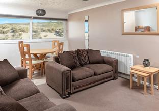 Find yourself just moments from the majestic dunes and three miles of sandy beach.