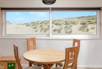 Stunning sea views of the sand dunes are the backdrop to your holiday mealtimes.