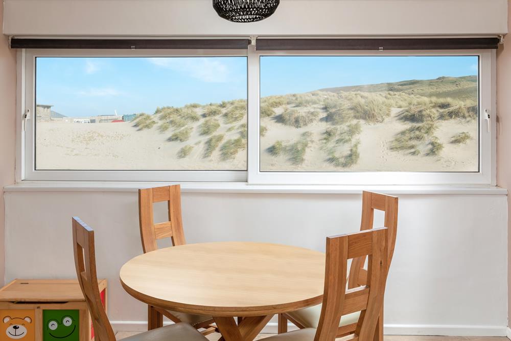 Stunning sea views of the sand dunes are the backdrop to your holiday mealtimes.