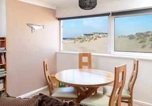 Enjoy the beach and sea views of the dunes while tucking into dinner!