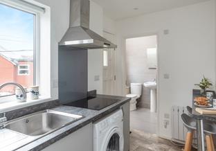 From the front door you're straight into the kitchen, with the bathroom close by for rinsing those sandy toes.