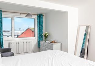 Enjoy beautiful beach and sea views from the master bedroom.