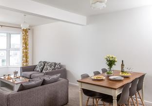The living and dining space has ample room for everyone to relax and dine together.